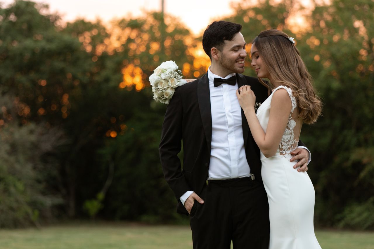 Lovely bride and groom embracing outdoors at sunset in Córdoba, Argentina, embracing romance.